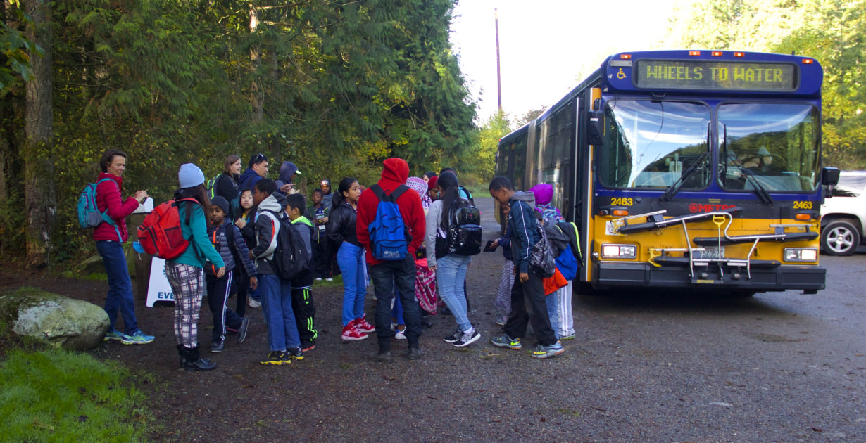 kids waiting to board school bus