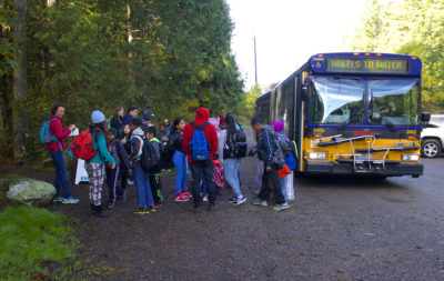 kids waiting to board school bus