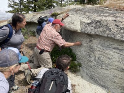 Karl Lillquist points out features of the Roslyn Sandstone formation to event attendees on the hike to Cheese Rock.
